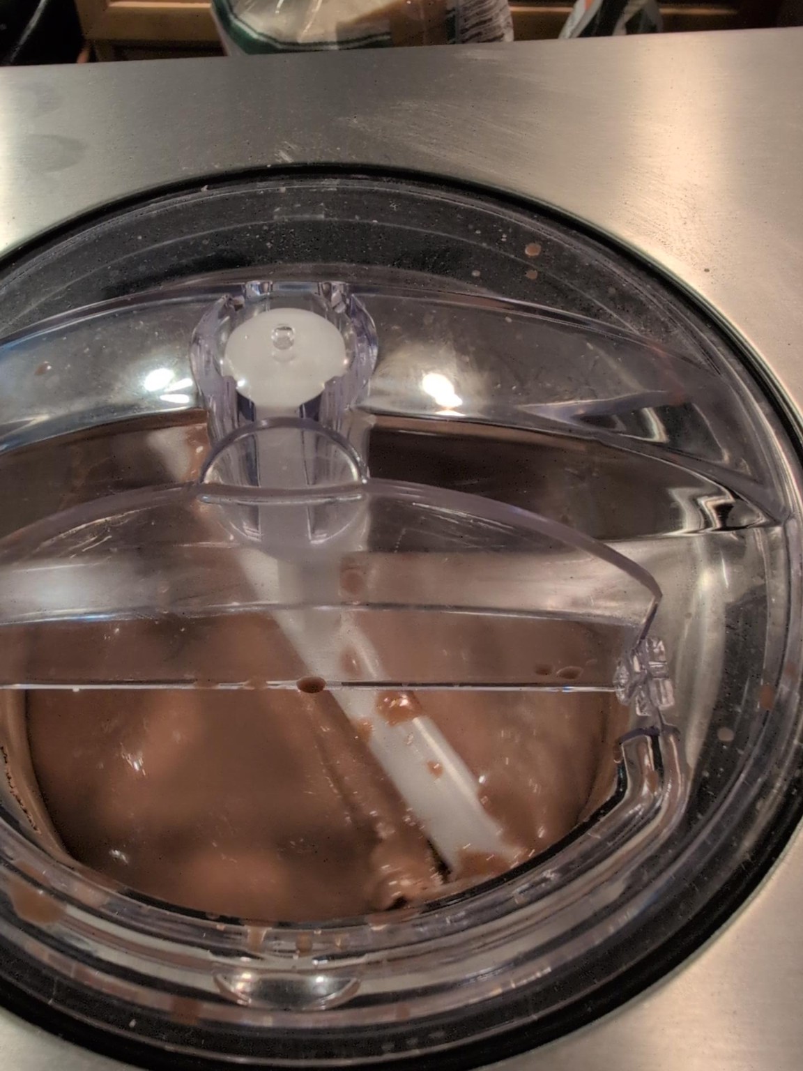 Smooth chocolate banana gelato base beginning to churn